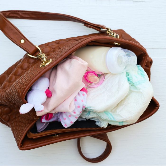 Mother's handbag with items to care for child.