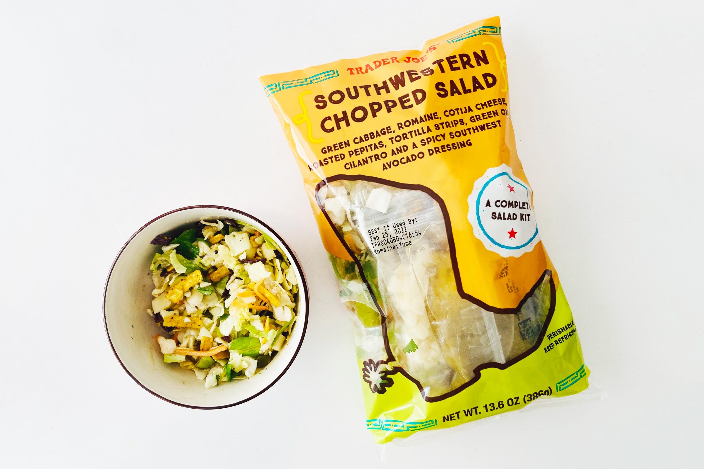 Trader Joe's salad bag with a bowl of Salad