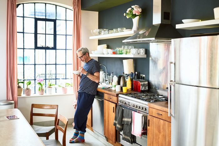 Mature man eating breakfast in the morning