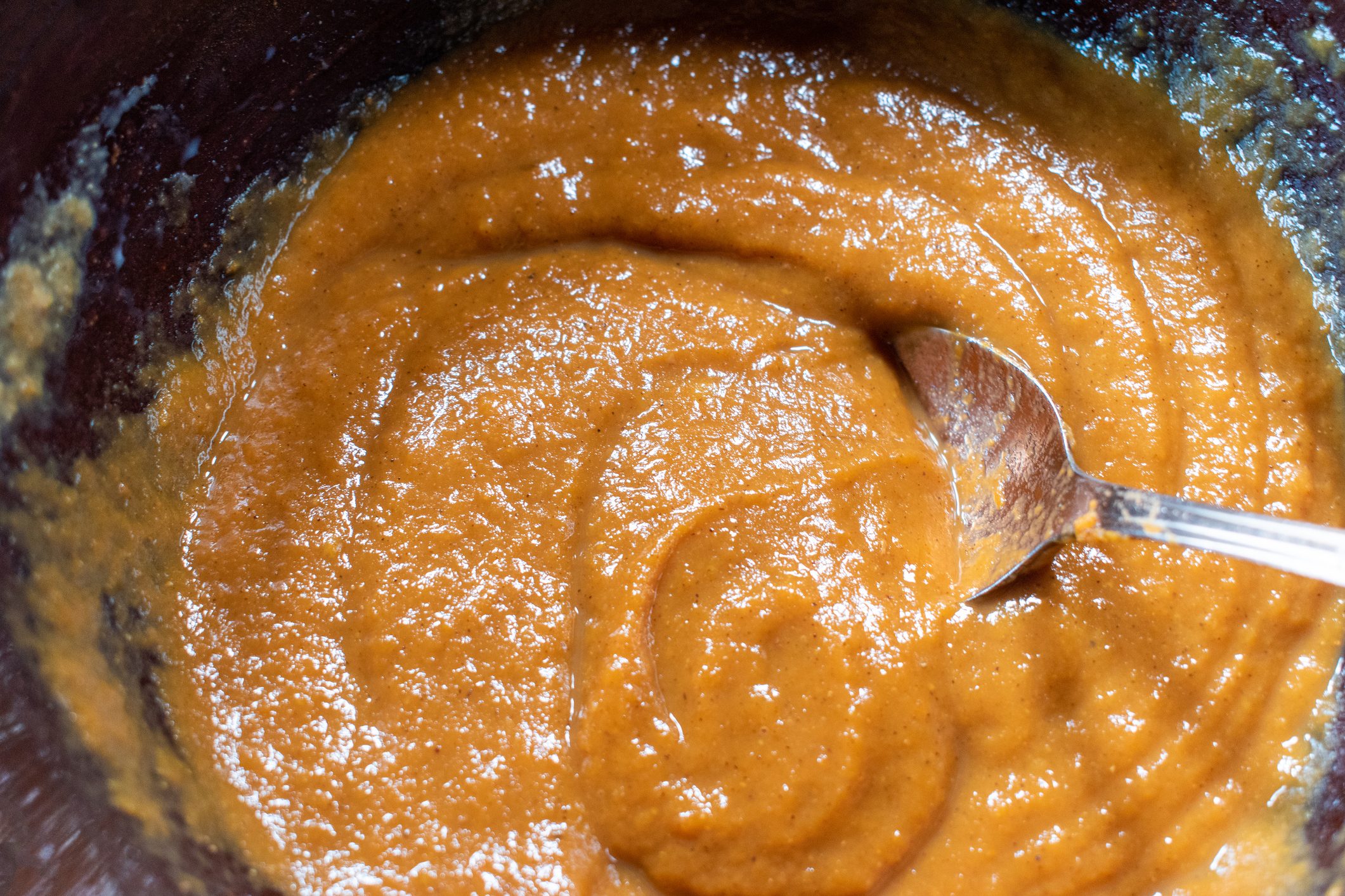top view of mixing bowl of pumpkin batter