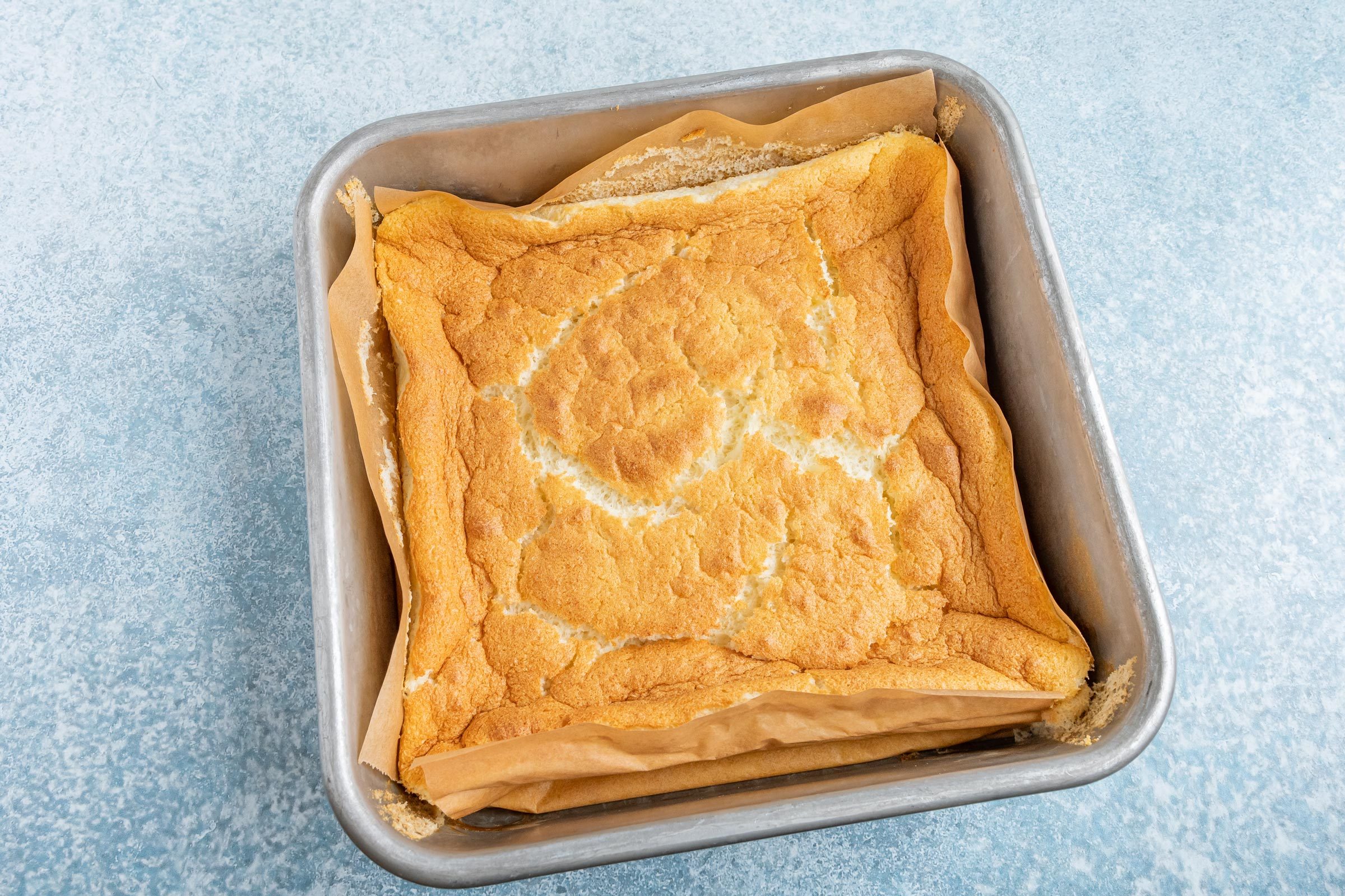 baked magic cake still in the square baking pan