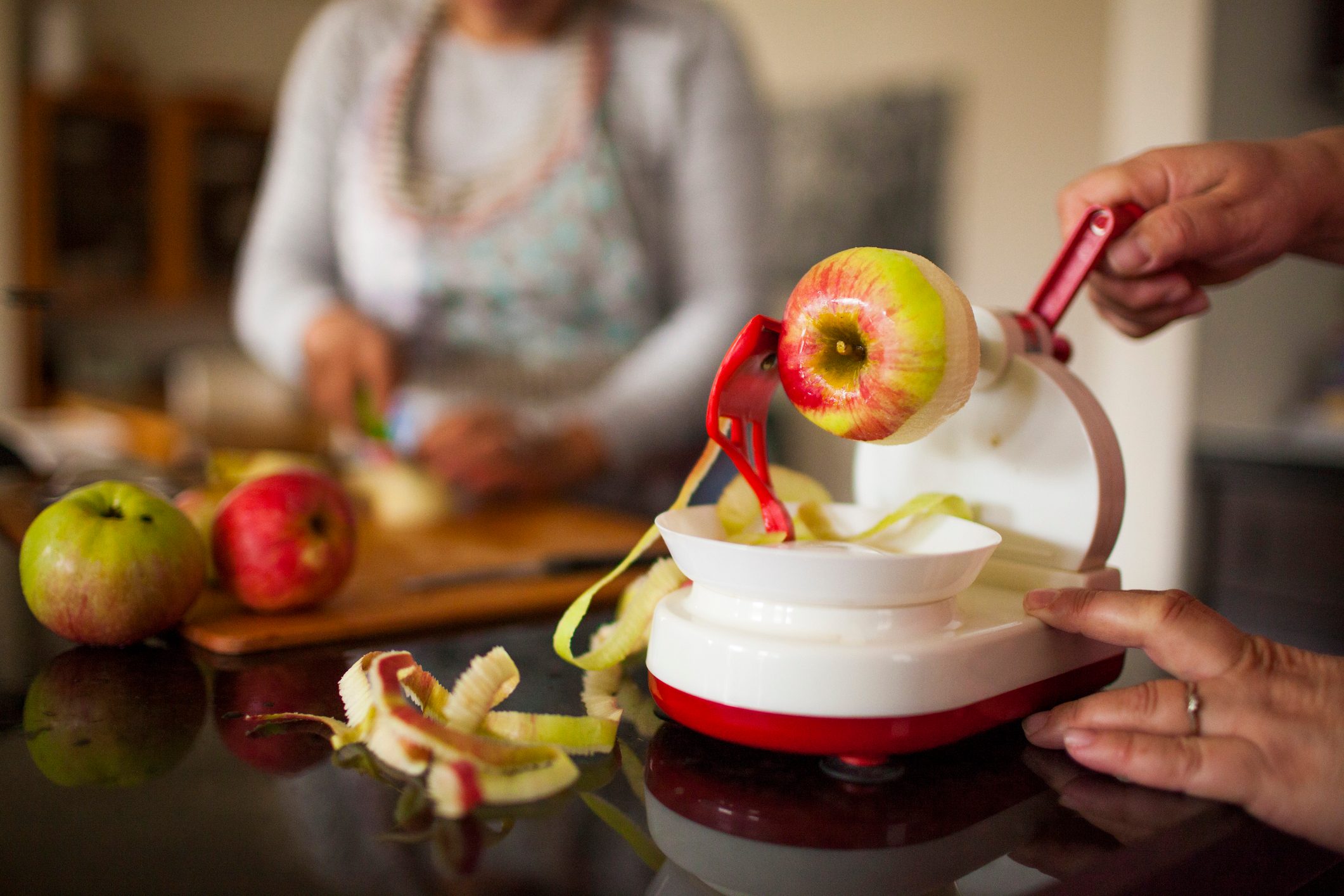 Person using apple peeler