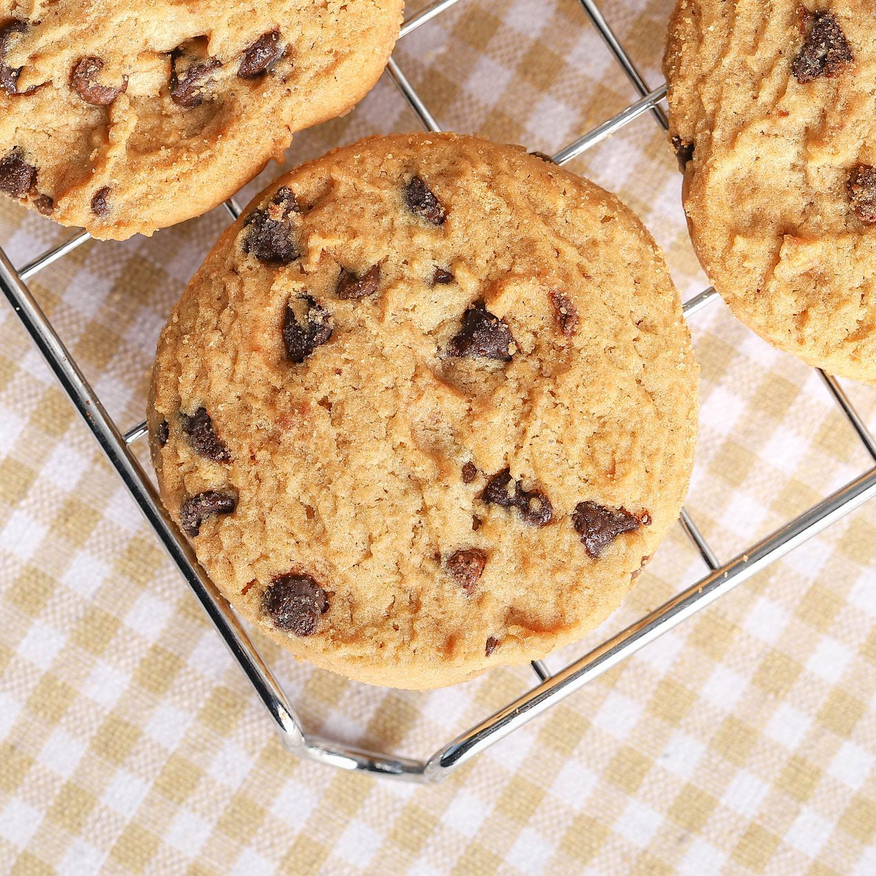 Delicious cookies with chocolate chips on metal grid. Chocolate chip cookies shot.