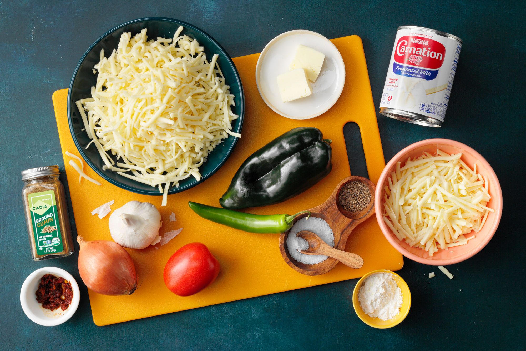 Copycat Chipotle Queso Blanco Ingredients on dark blue background