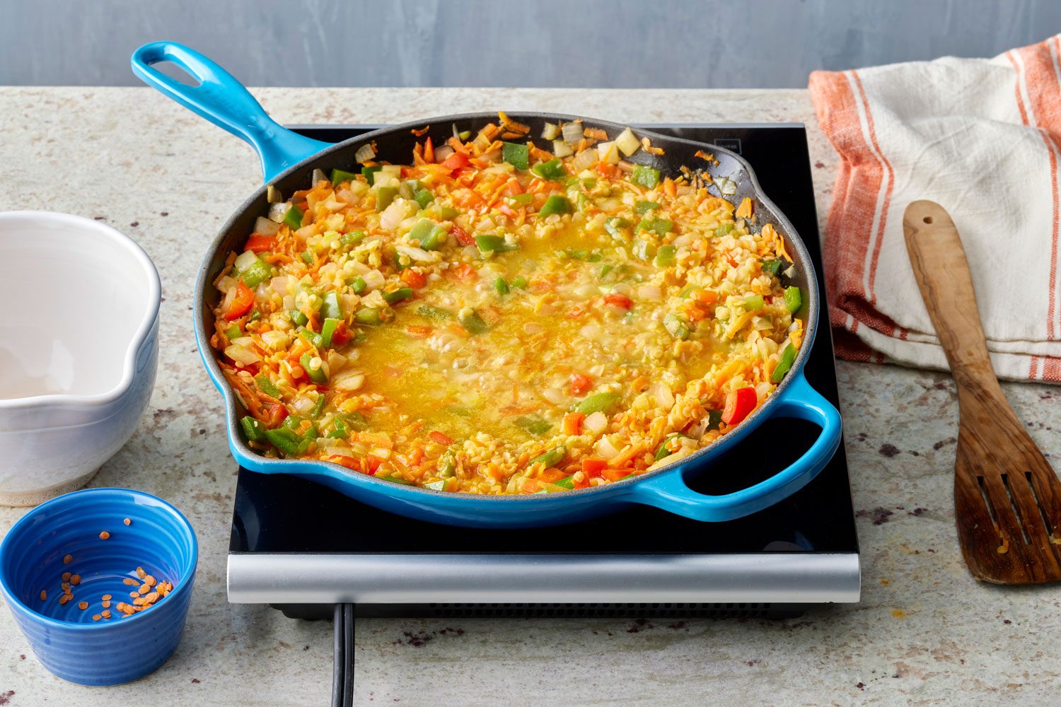simmer the mixture after adding the broth and lentils