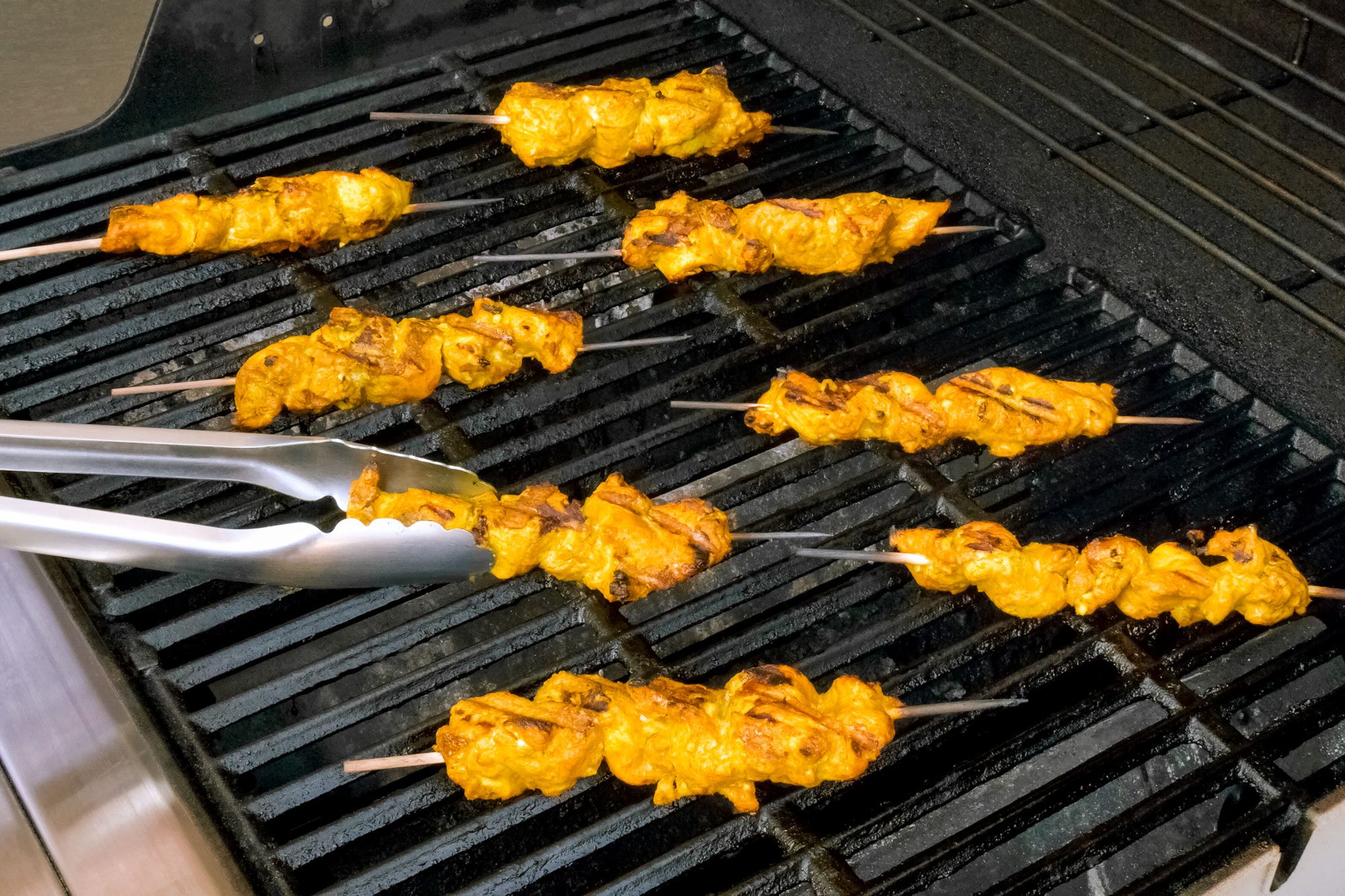 Roasting Chicken Satay on Grill