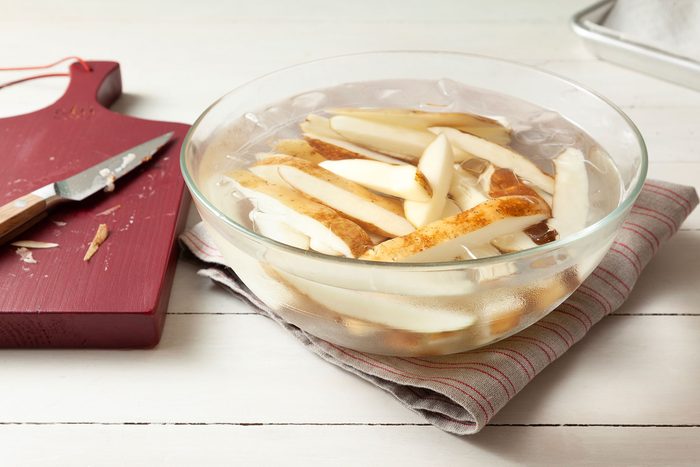 French fries cooling in water with ice