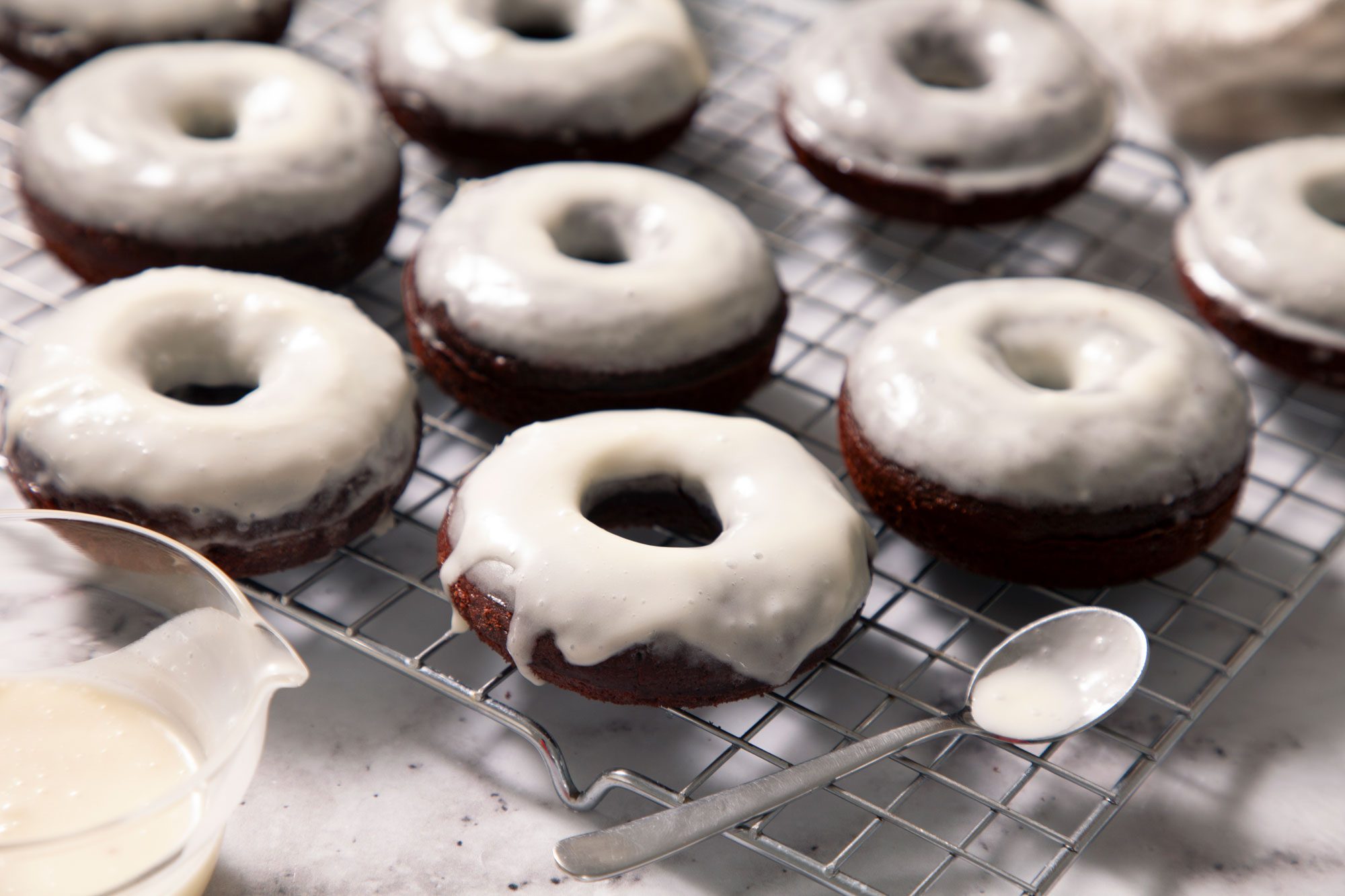 Glazed Chocolate Doughnuts on wire rack