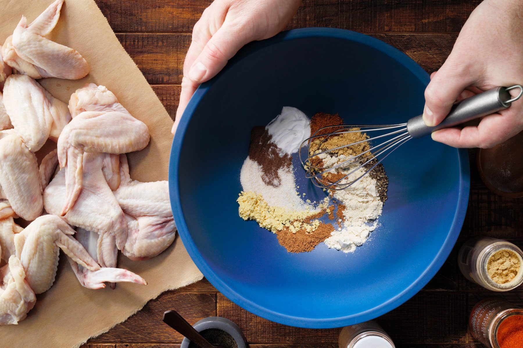 Mixing the garlic powder, garlic salt and other ingredients in a large bowl