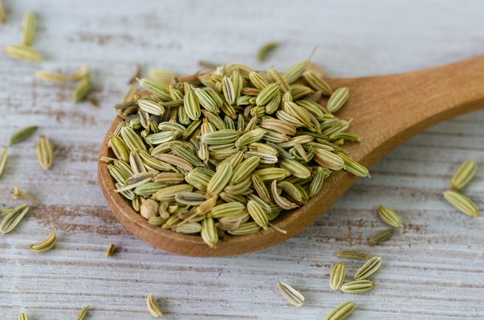 Fennel seeds on wooden spoon