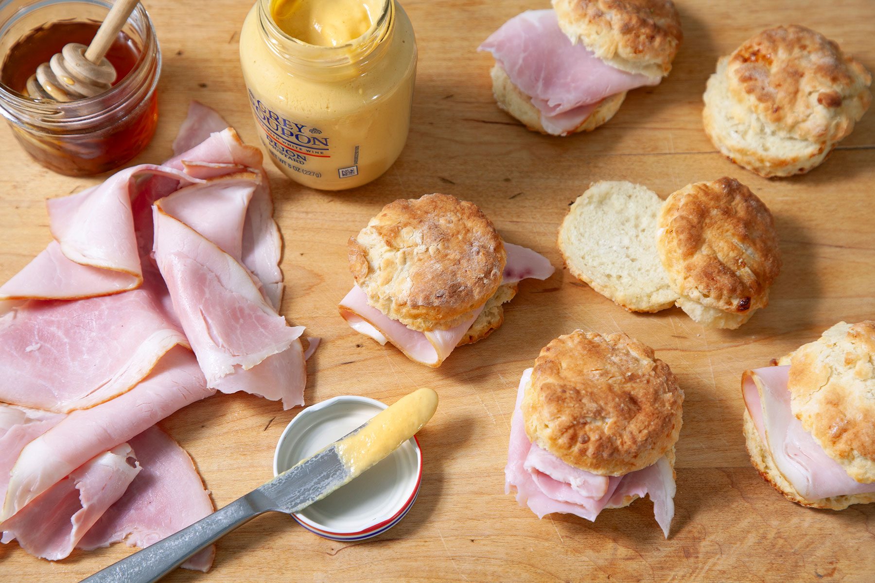 Applying butter on biscuit