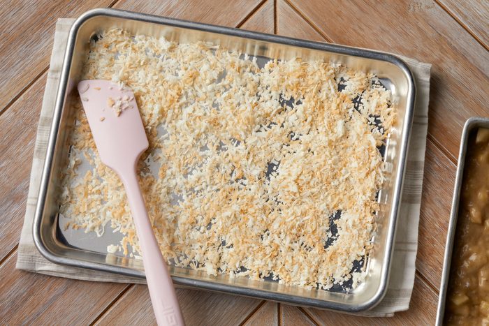 Toast the coconut shreds until golden brown