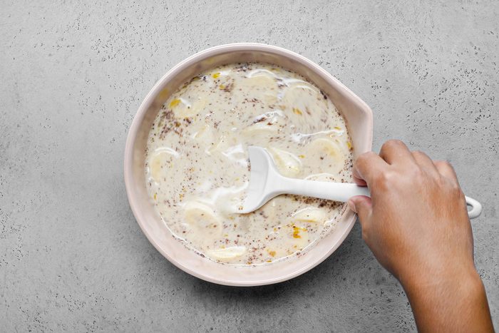 Stirring Bananas in a large bowl
