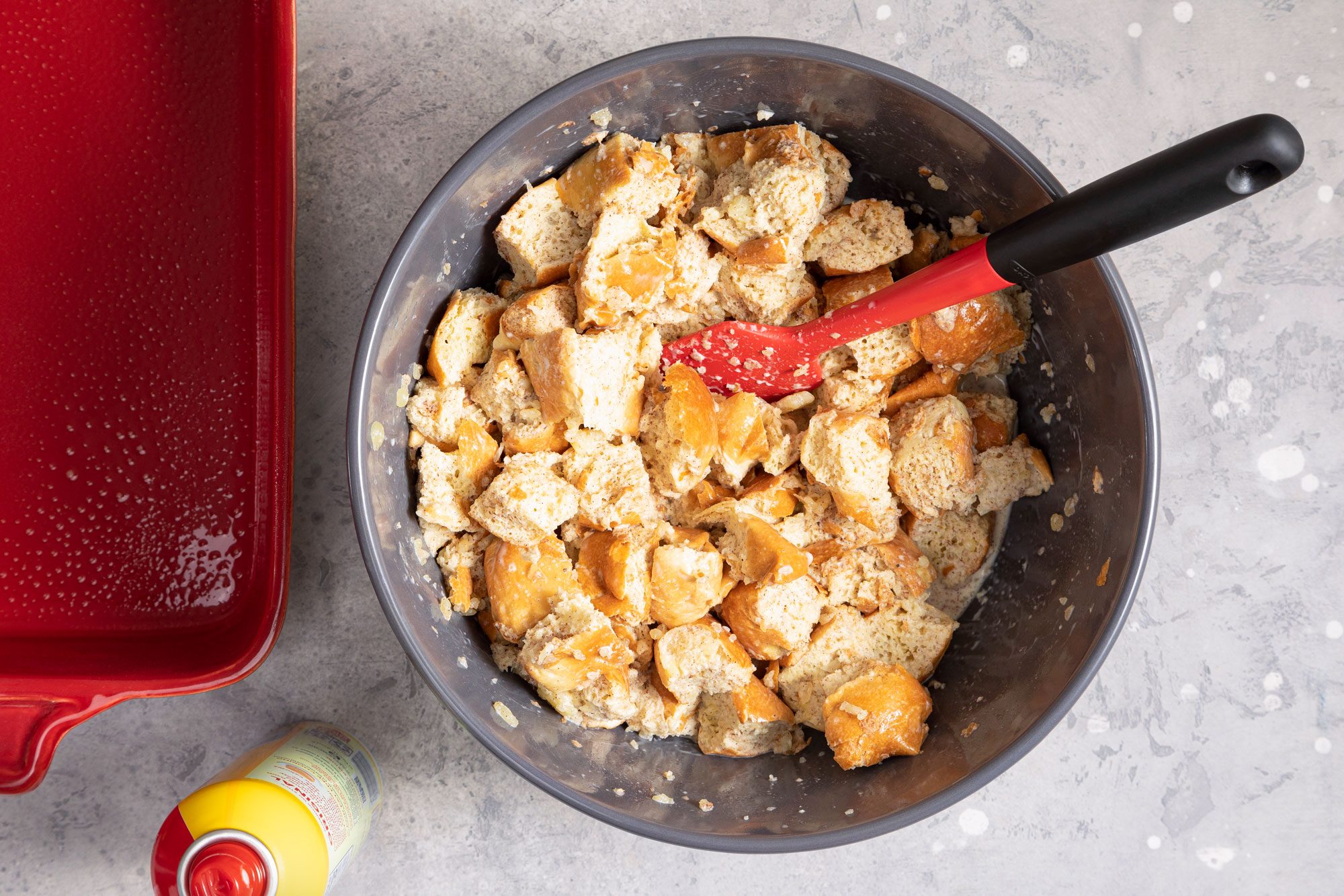 wet bread cubes in a large bowl with spatula
