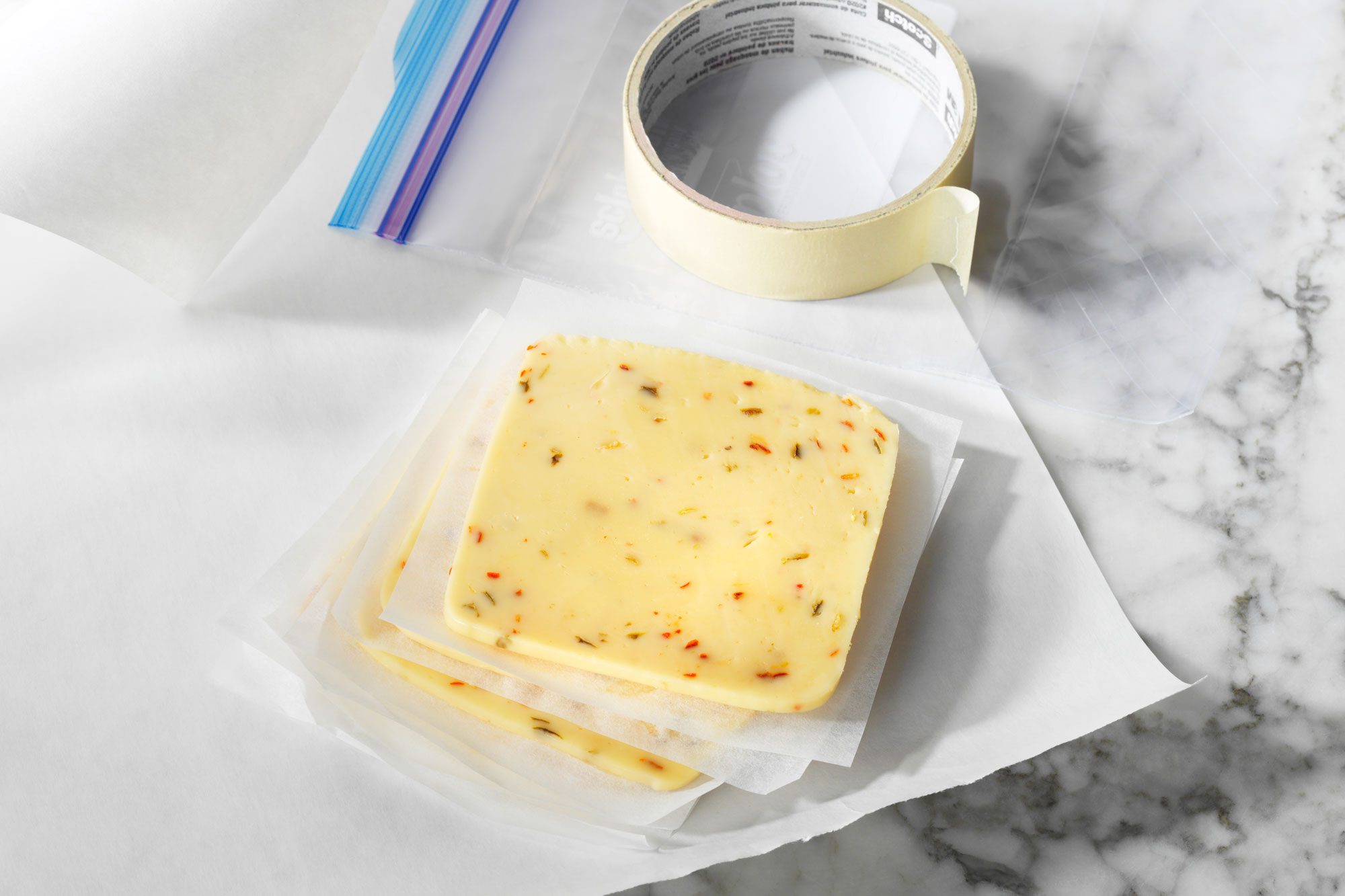 sliced cheese being prepared for proper freezing
