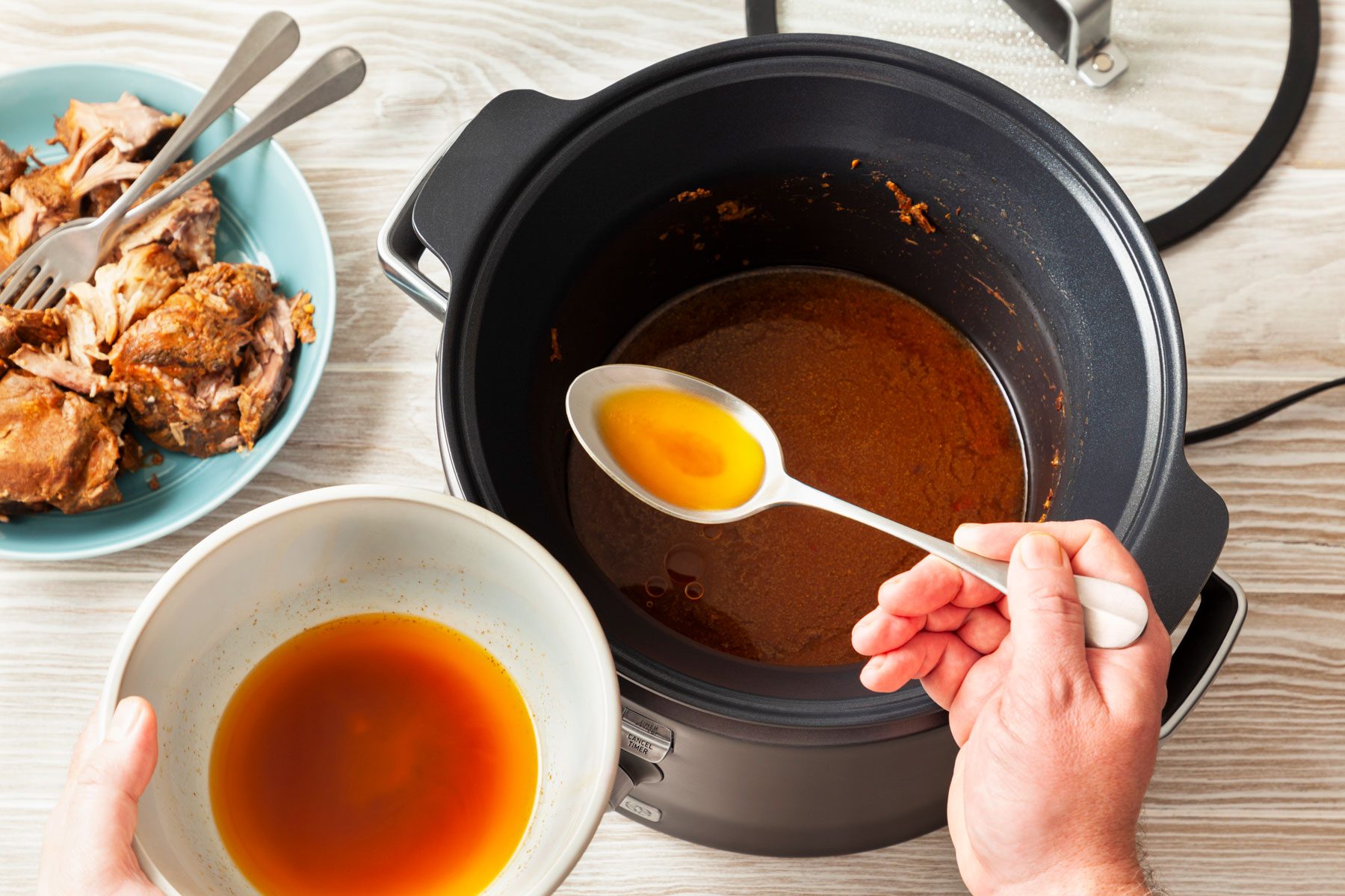 Skimming the fat from the cooking juices