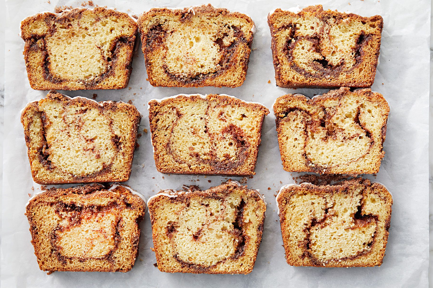 overhead shot of cinnamon bread slices; white background; white background;