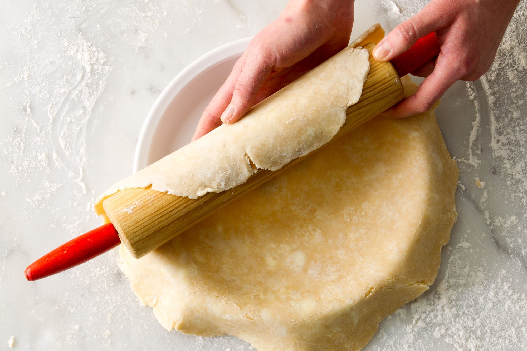 Transferring pie crust from rolling pin to pie dish