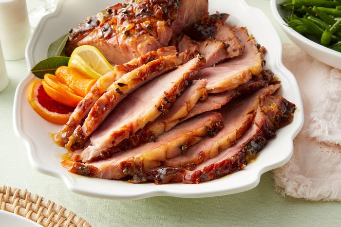 Easter ham garnished with fruit on a serving dish