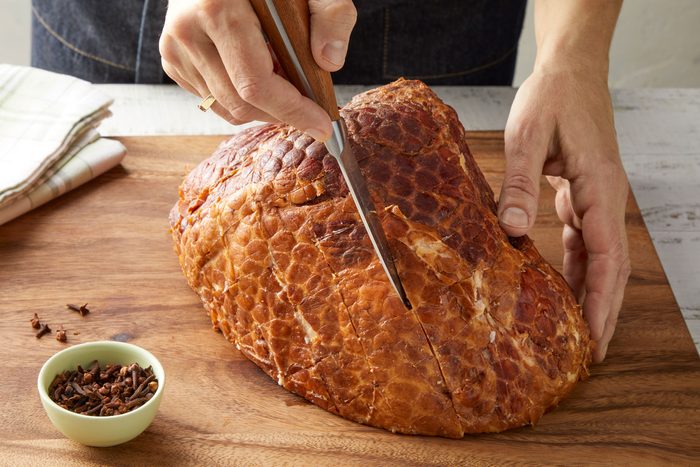 Cut side down of ham on a rack