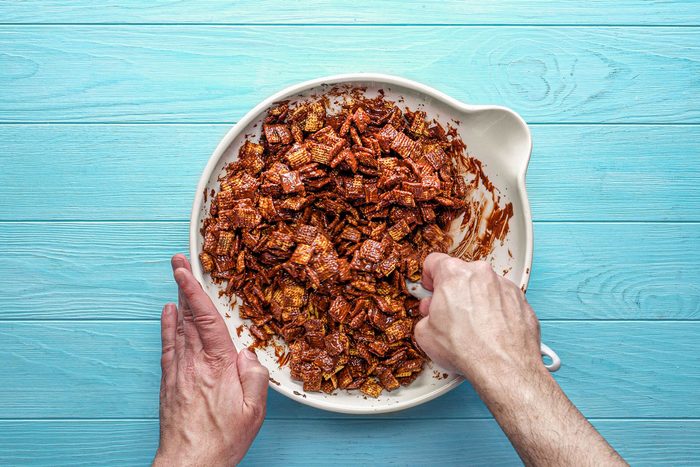 Gently stir with a spatula to coat the Chex