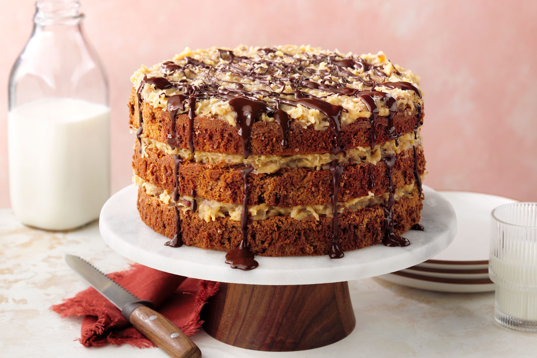 German-Chocolate-Cake served on a table with milk