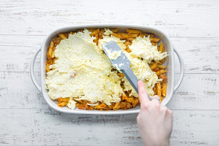 Top the pasta with the Romano cheese