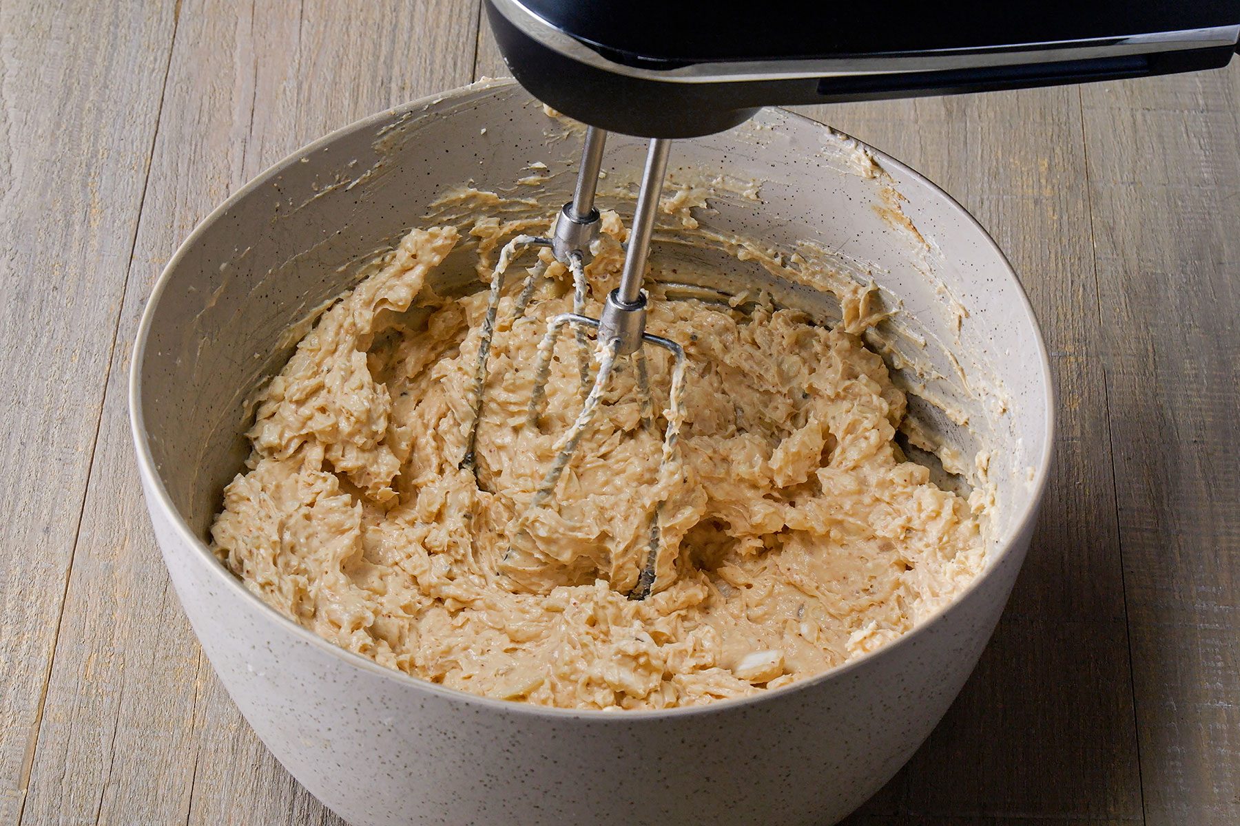 Whisking ingredients in large bowl