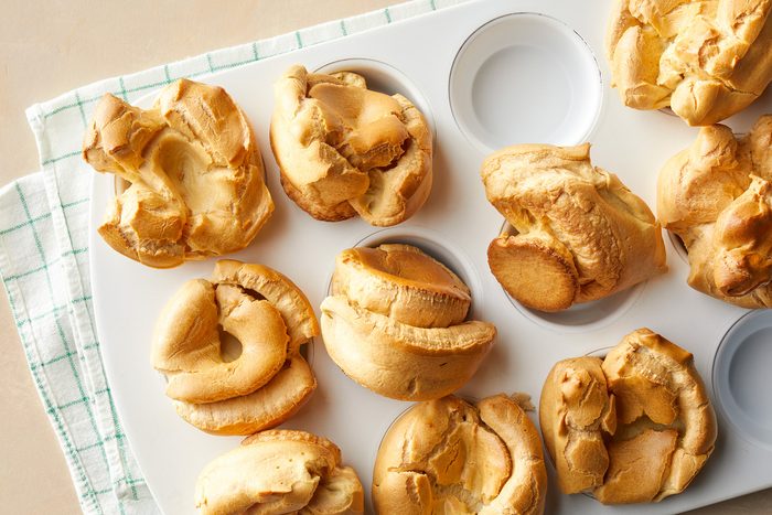 A muffin tray with baked Popovers