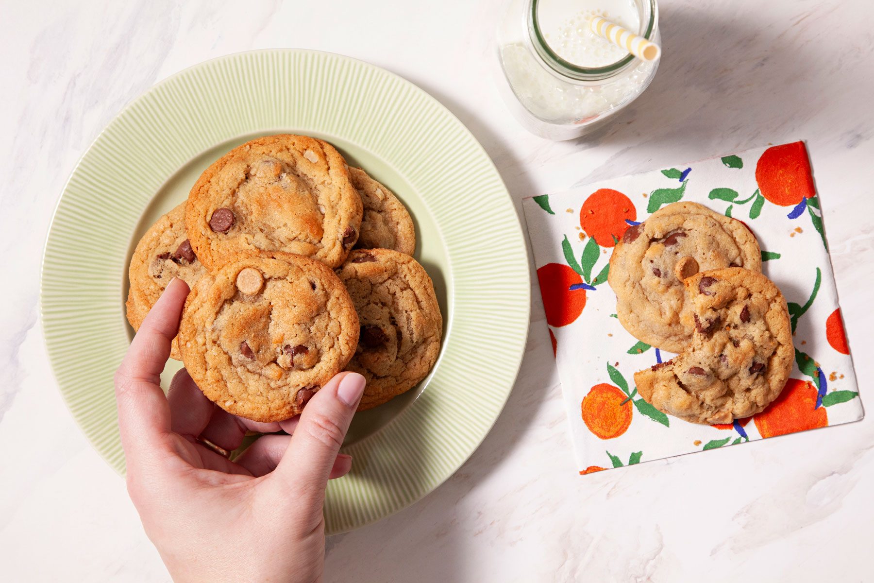Peanut Butter Oatmeal Chip Cookies served in a small plate with a glass of milk