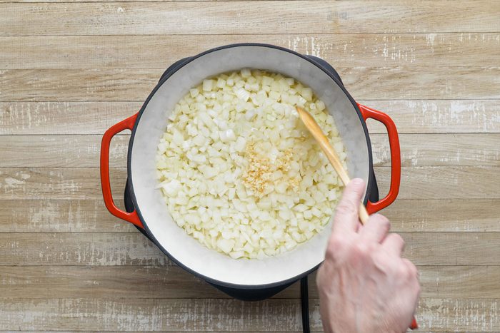 Saute onions and garlic in 1 tablespoon of olive oil in dutch oven