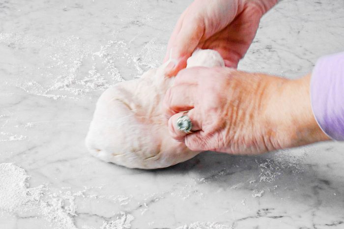 kneading the pizza dough