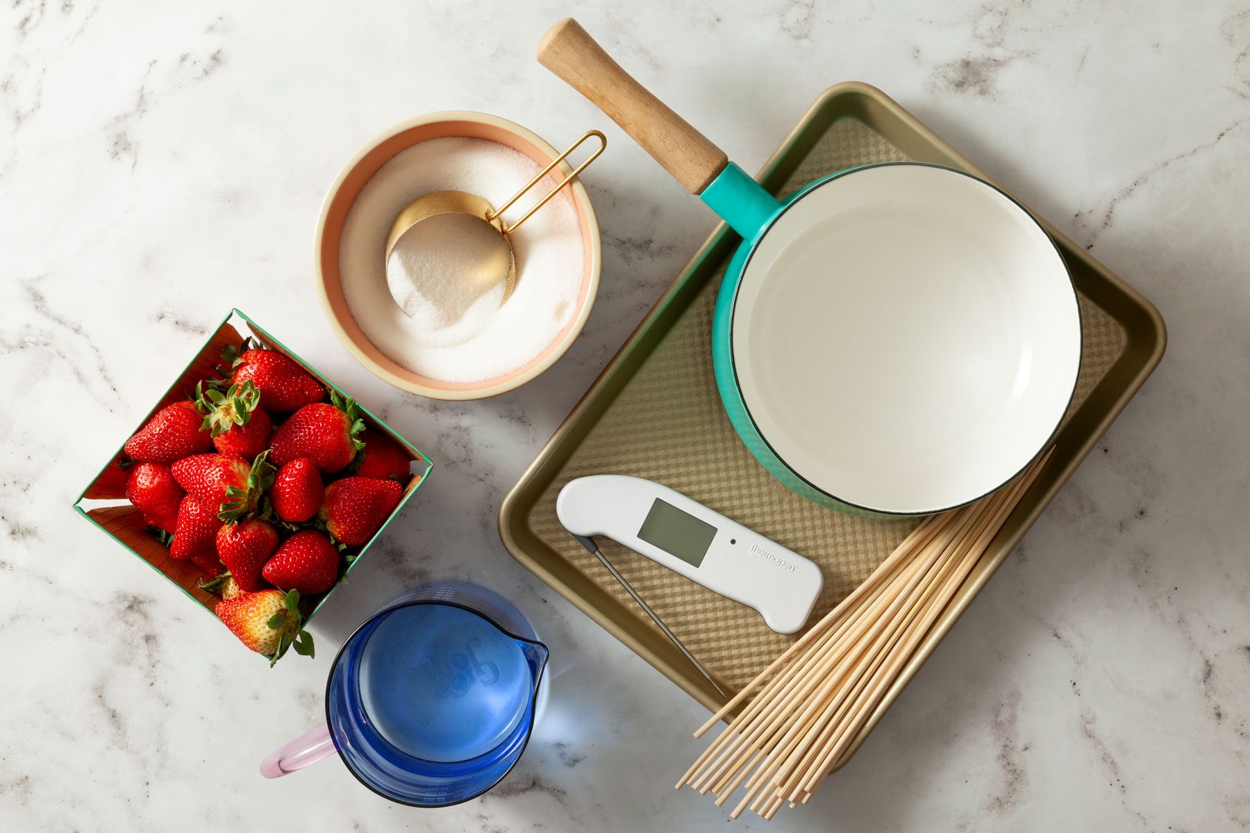 Firm strawberries Sugar syrup and other ingredients on marble surface