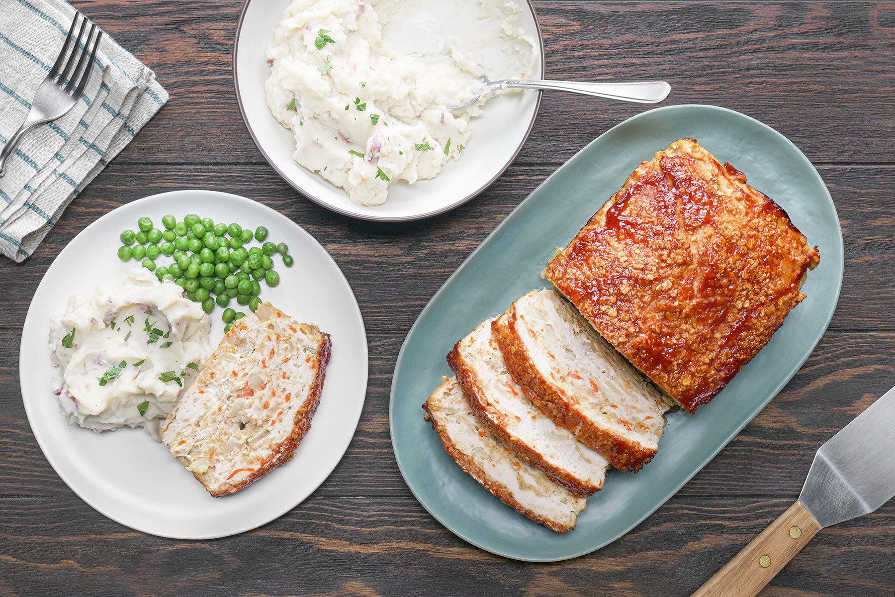 Turkey Meat Loaf served on blue plate with mashed potato on the side