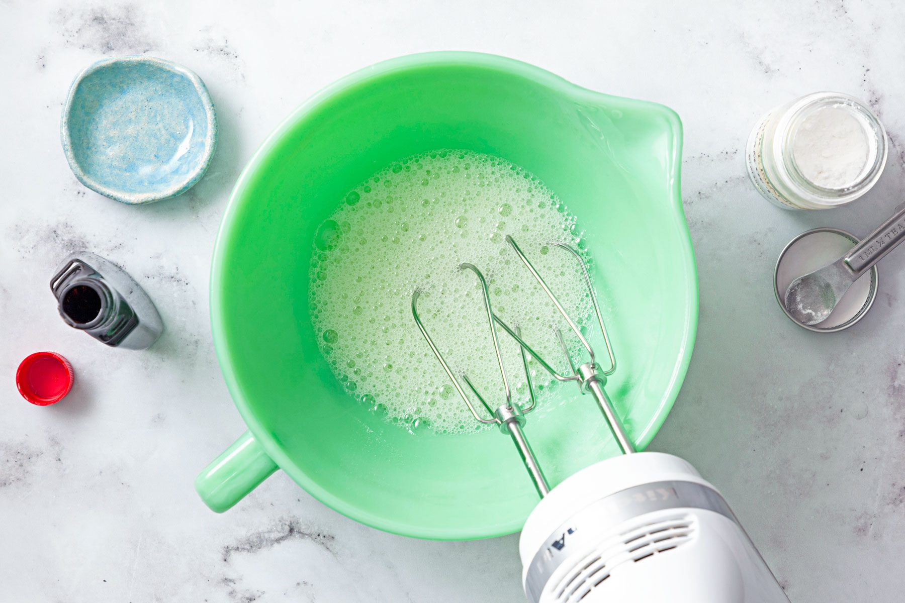 vanilla, cream of tartar and salt to the egg whites mixed in a large bowl with a blender