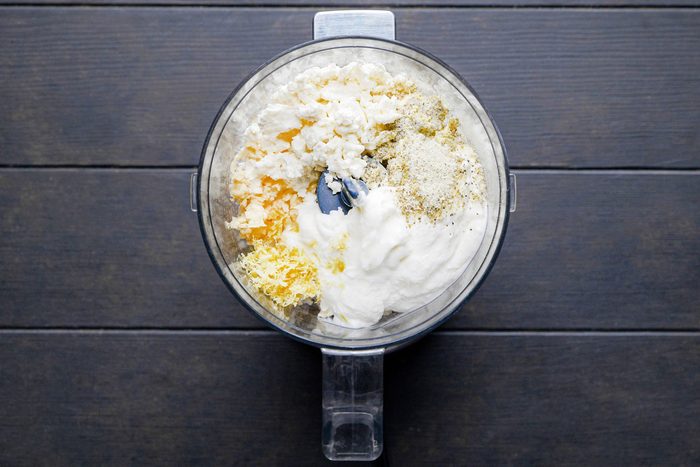 Ingredients to make Whipped Feta Dip mixed in a blender