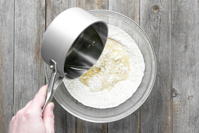 Adding boiled the liquid into dry ingredients