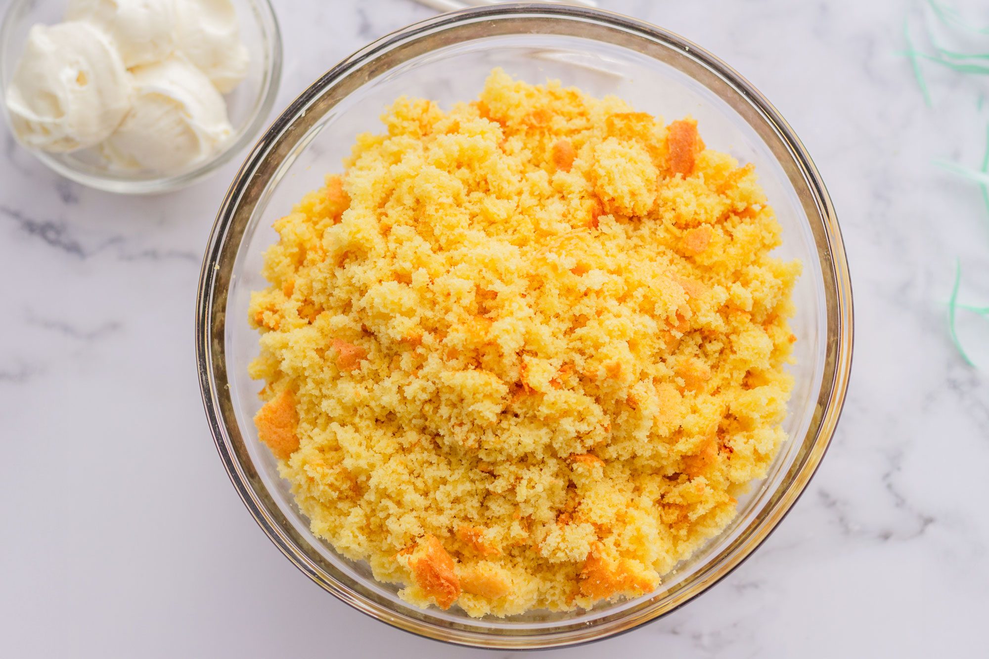 Crumble the baked cake into a large bowl