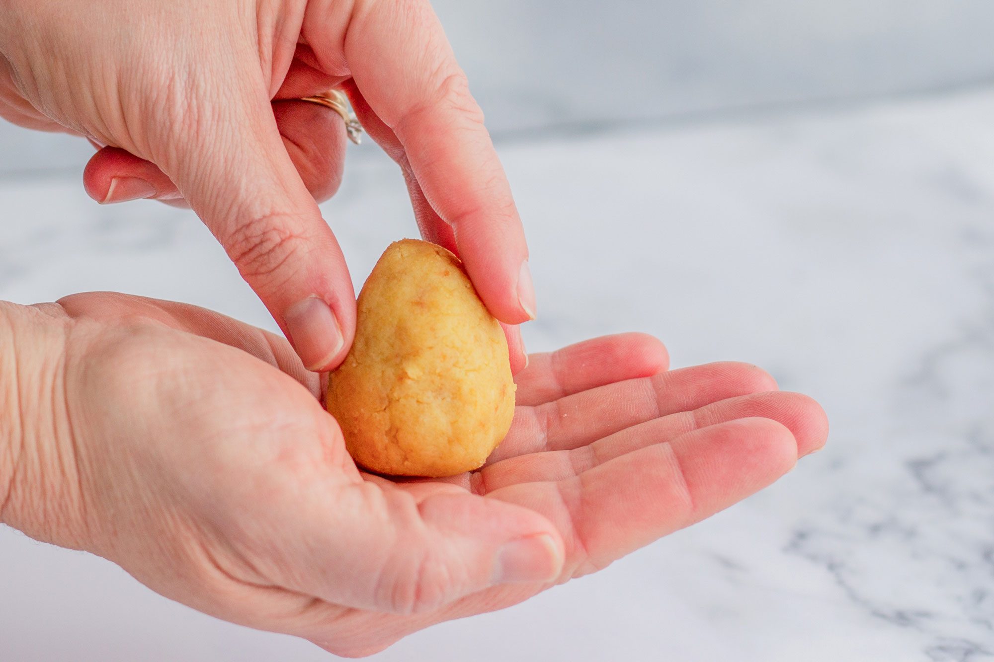 Shape the ball into an egg shape