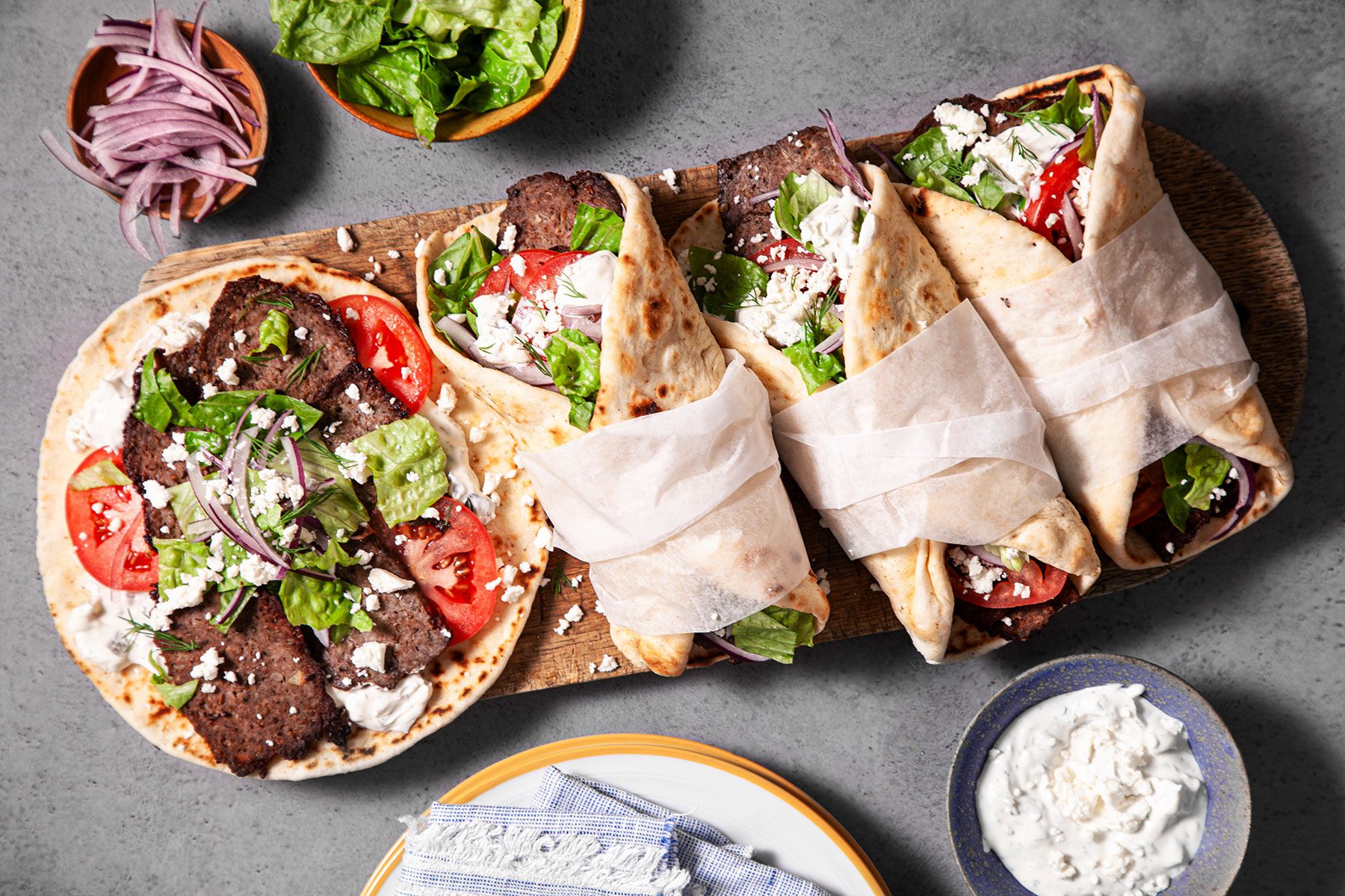 Gyros served on plate with vegetables