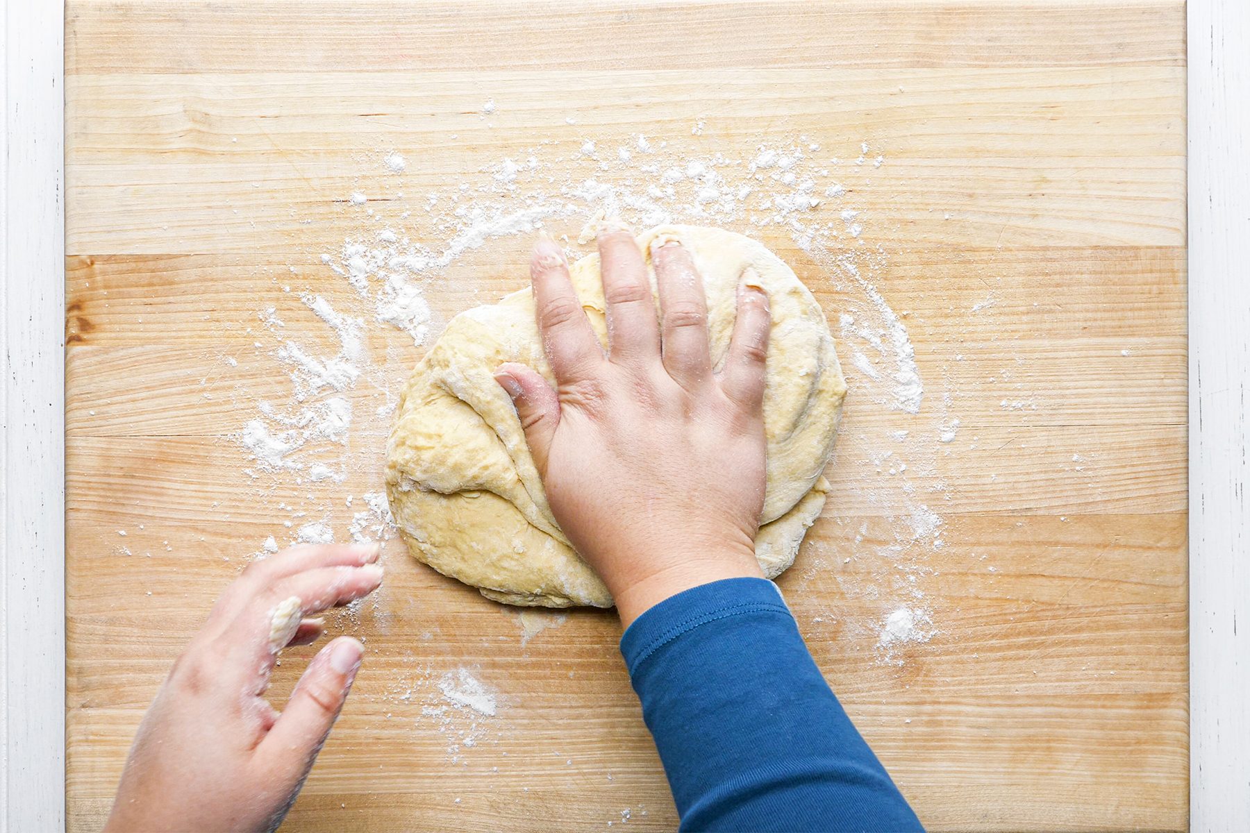 A person's kneading dough
