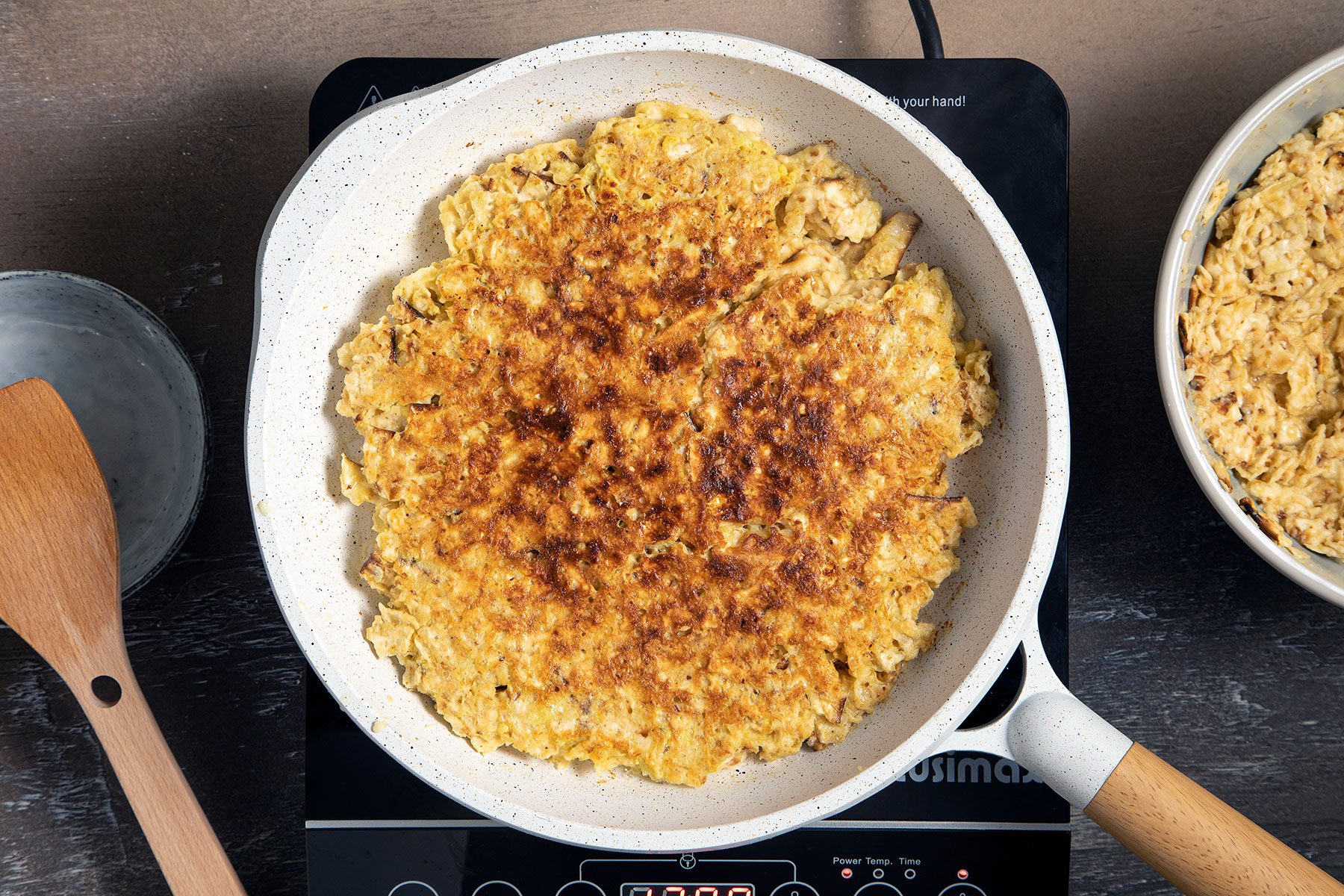 Flipped cooked Matzo Brei in pan