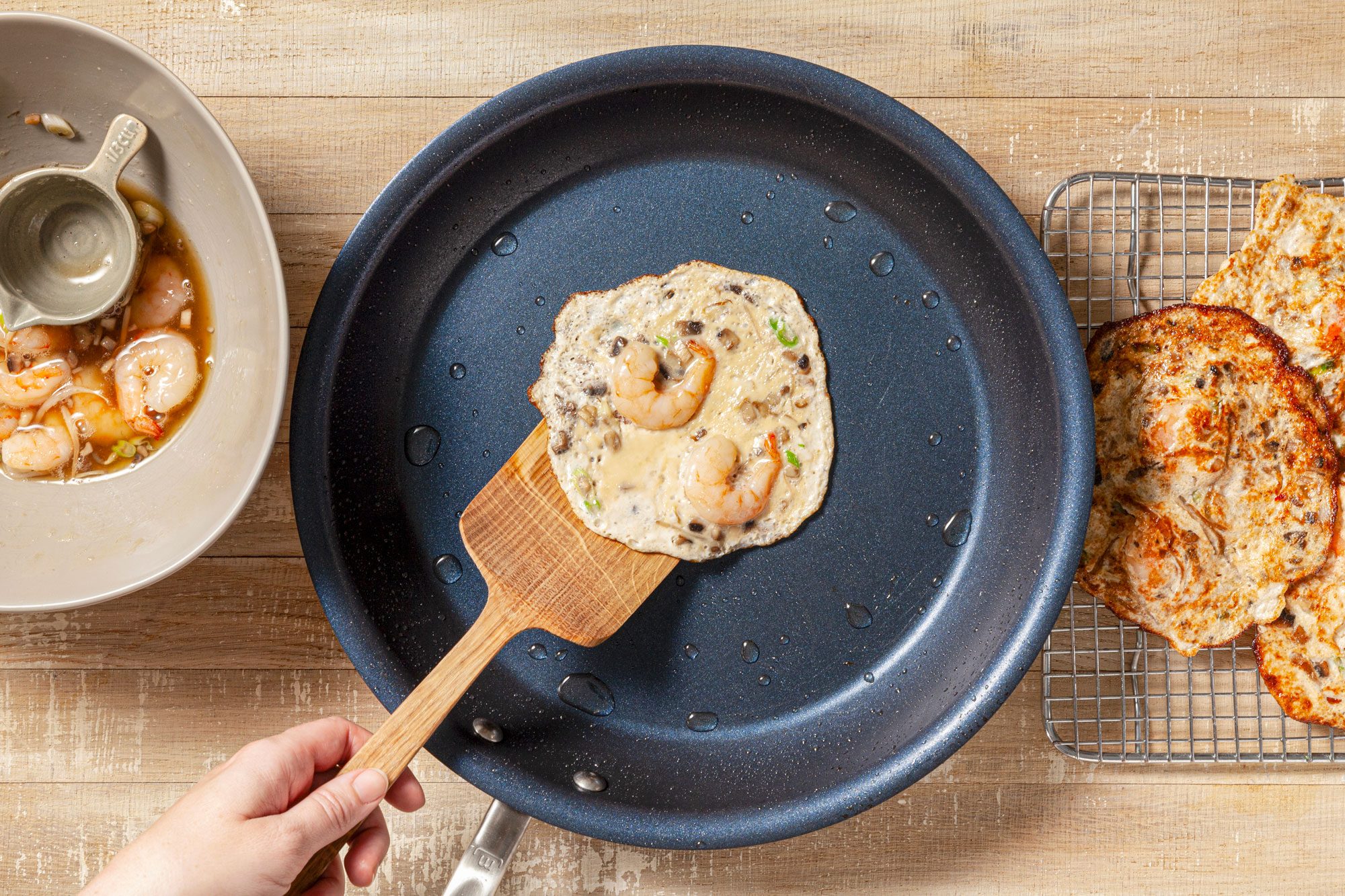 Cooking Shrimp Egg Foo Young in a pan
