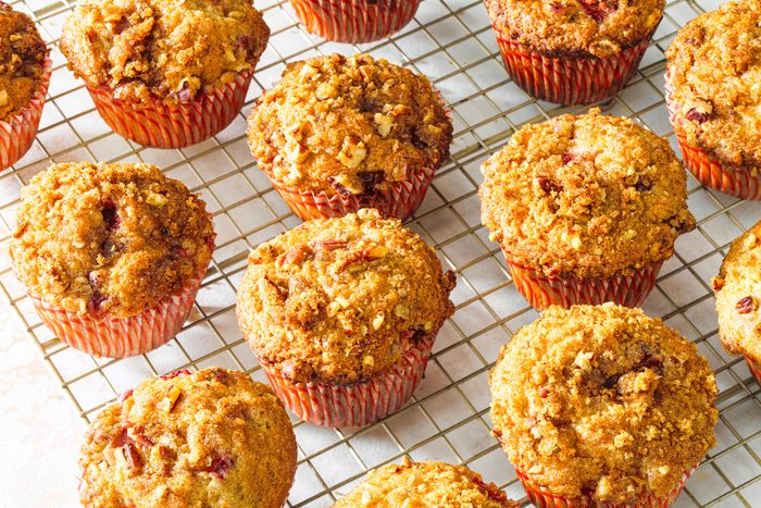Strawberry Rhubarb Muffins on a wire rack