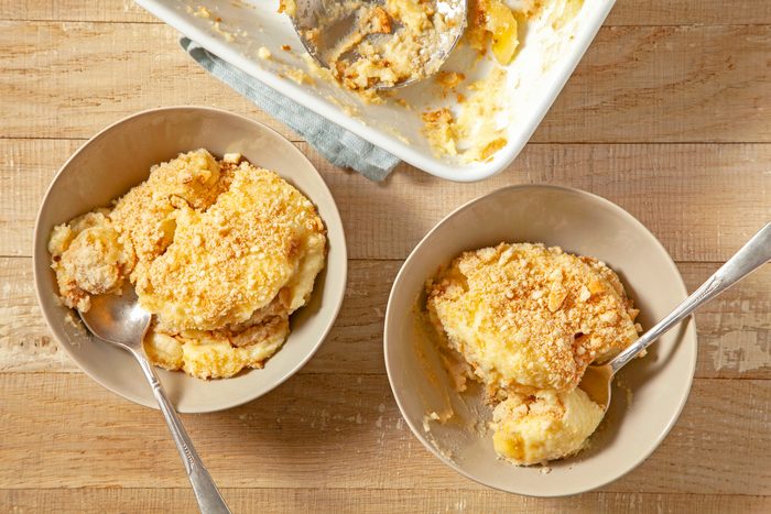 Two bowls of banana pudding on a wooden table