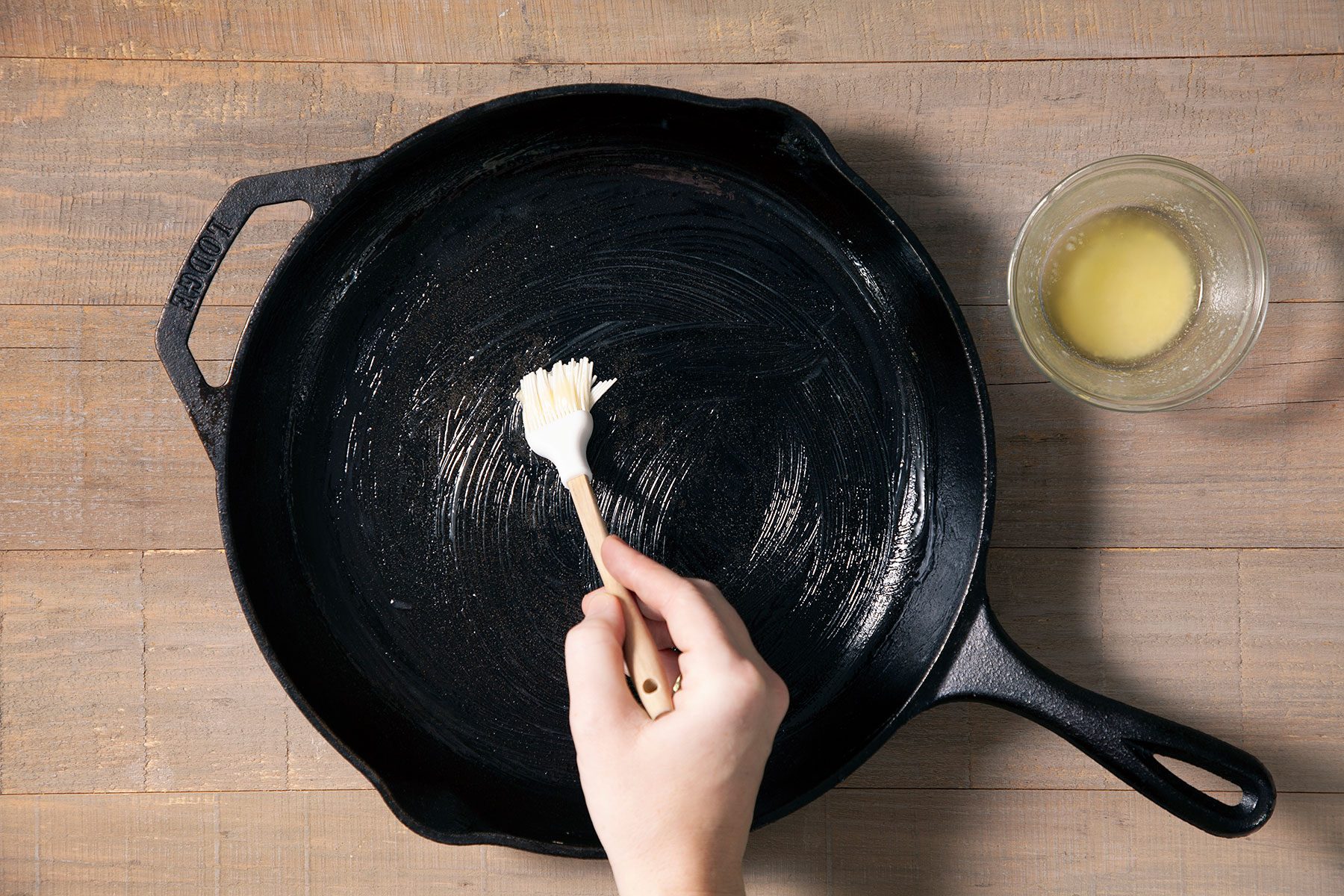 Brushing the cast Iron with butter