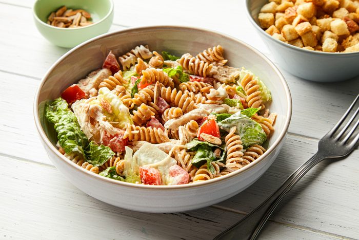 A bowl of Chicken Pasta Caesar Salad