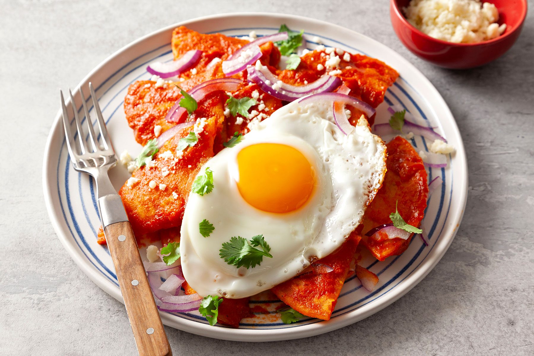 Chilaquiles served on plate with fork