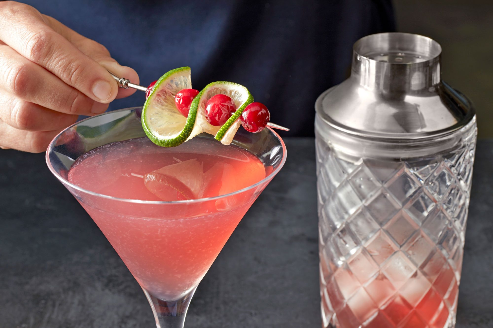 Garnish with lime and cranberries