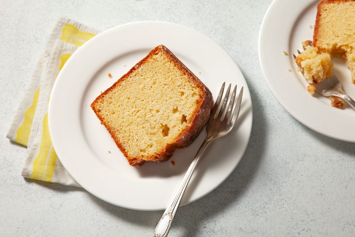 overhead shot of a piece of Kentucky Butter Cake served on a plate with a fork